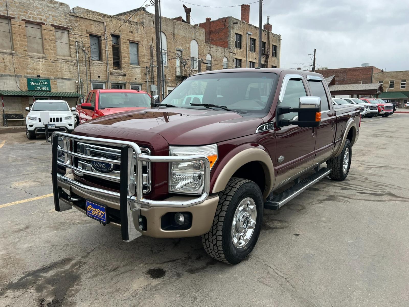 2012 Maroon /Brown Ford F-350 SD King Ranch (1FT8W3BT7CE) with an 6.7L V8 F OHV 32V DIESEL engine, Automatic transmission, located at 116 5th Avenue South, Lewistown, MT, 59457, 47.063877, -109.427879 - Introducing the ultimate combination of power and luxury – the 2012 Ford F350 Crew Cab King Ranch 4x4. With its robust Powerstroke diesel engine, this truck is built to handle anything you throw at it. Whether you're towing a trailer or cruising around town, the F350 delivers top-notch performance - Photo #6